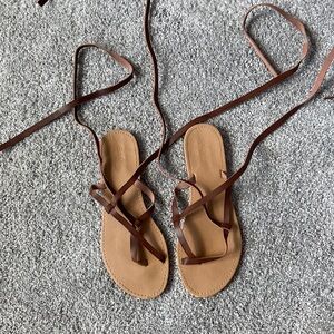 Sandals that wrap around the ankles.